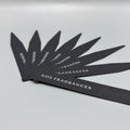 Black smelling strips with 'KOS FRAGRANCES' branding on a gray background